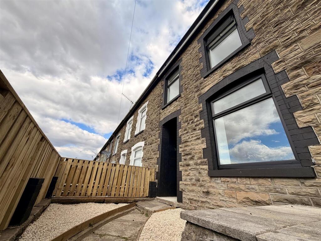 Refurbished stone-fronted terrace with new windows, door and fencing
